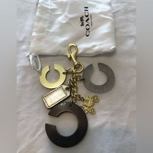 Coach bag charm brass/wood/etched plastic/silver hang tag